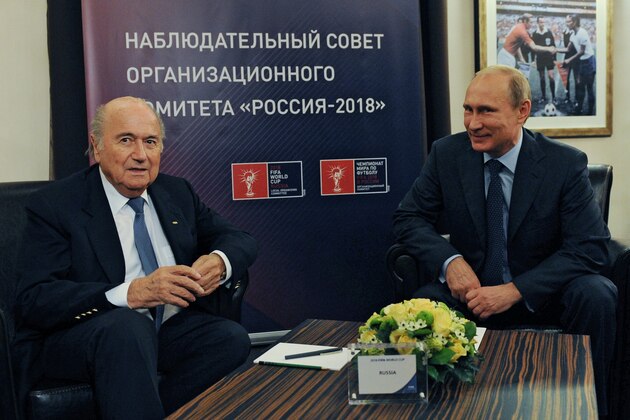 Russian President Vladimir Putin, right, and FIFA President Sepp Blatter meet in Moscow, Russia, Tuesday, Oct. 28, 2014. Putin and Blatter on Tuesday visited  the Luzhniki Stadium which is under reconstruction for the final of the 2018 World Cup. The sign reads Russia-2018 Local Organizing Committee.  (AP Photo/RIA-Novosti, Mikhail Klimentyev, Presidential Press Service)