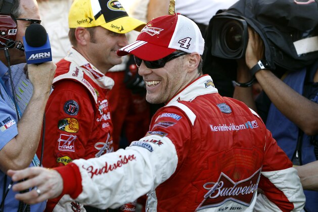 Driver Kevin Harvick celebrates in victory lane after winning the Quicken Loans Race for Heroes 500 NASCAR Sprint Cup Series auto race at Phoenix International Raceway, Sunday, Nov. 9, 2014, in Avondale, Ariz. (AP Photo/Ralph Freso)