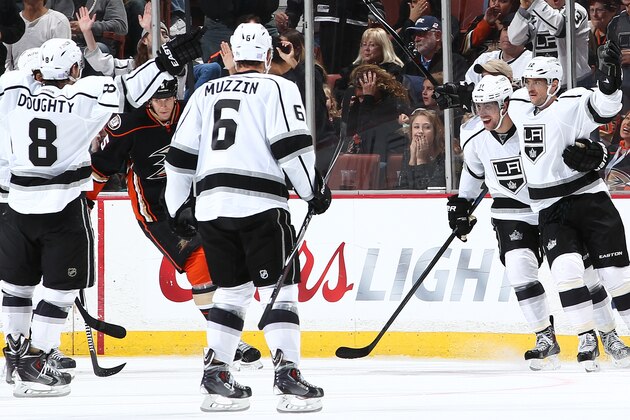 ANAHEIM, CA - NOVEMBER 12:  Marian Gaborik #12 of the Los Angeles Kings celebrates scoring a goal with Anze Kopitar #11 as the rest of the players gather against Bryan Allen #5 of the Anaheim Ducks skating by on November 12, 2014 at Honda Center in Anaheim, California. (Photo by Debora Robinson/NHLI via Getty Images)