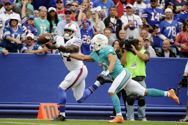 Buffalo Bills wide receiver Sammy Watkins (14) can't catch the ball as Miami Dolphins cornerback Brent Grimes (21) defends during the first half of an NFL football game on Sunday, Sept. 14, 2014, in Orchard Park, N.Y. (AP Photo/Gary Wiepert)