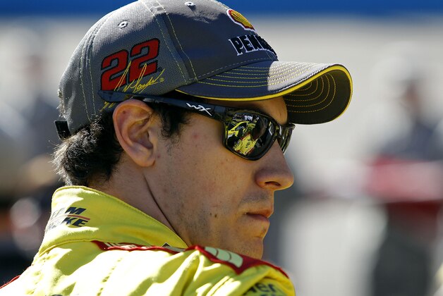 Driver Joey Logano looks on from pit row before the Quicken Loans Race for Heroes 500 NASCAR Sprint Cup Series auto race at Phoenix International Raceway, Sunday, Nov. 9, 2014, in Avondale, Ariz. (AP Photo/Ralph Freso)
