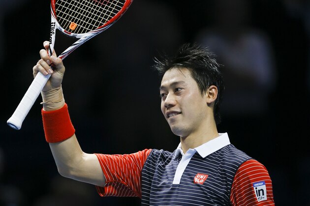 Japan’s Kei Nishikori celebrates winning against Spain's David Ferrer during their ATP World Tour tennis finals match at the O2 arena in London, Thursday, Nov. 13, 2014. (AP Photo/Kirsty Wigglesworth)