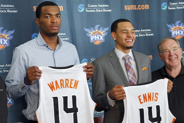 Phoenix Suns first round draft picks Tyler Ennis, and T.J. Warren, left, hold their jerseys after being introduced by the NBA basketball team, Friday, June 27, 2014, in Phoenix. (AP Photo/Matt York)