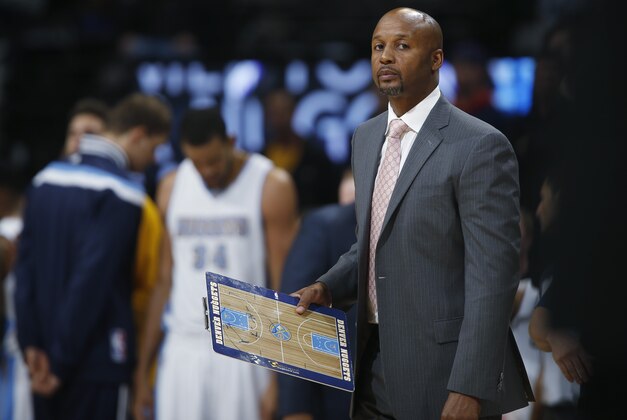 Denver Nuggets head coach Brian Shaw looks on against the Sacramento Kings in the fourth quarter of the Kings' 110-105 victory in an NBA basketball game in Denver on Monday, Nov. 3, 2014. (AP Photo/David Zalubowski)