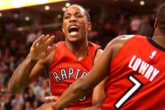 BOSTON, MA - NOVEMBER 05: DeMar DeRozan #10 of the Toronto Raptors reacts after a dunk in the second half against the Boston Celtics at TD Garden on November 5, 2014 in Boston, Massachusetts. NOTE TO USER: User expressly acknowledges and agrees that, by downloading and or using this photograph, User is consenting to the terms and conditions of the Getty Images License Agreement.  (Photo by Mike Lawrie/Getty Images)