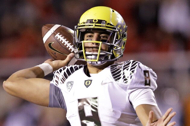 Oregon quarterback Marcus Mariota (8) passes the ball in the second half during an NCAA college football game against Utah Saturday, Nov. 8, 2014, in Salt Lake City. (AP Photo/Rick Bowmer)