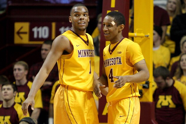 Nov 12, 2013; Minneapolis, MN, USA; Minnesota Golden Gophers guard Andre Hollins (1) celebrates with guard Deandre Mathieu (4) during the second half against the Montana Grizzlies at Williams Arena. Minnesota defeated Montana 84-58. Mandatory Credit: Brace Hemmelgarn-USA TODAY Sports
