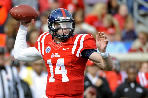 Mississippi quarterback Bo Wallace (14) releases a pass during the first half of an NCAA college football game against Presbyterian in Oxford, Miss., Saturday, Nov. 8, 2014. (AP Photo/Thomas Graning)
