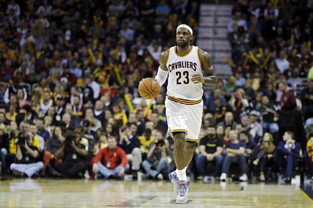 Cleveland Cavaliers' LeBron James brings the ball up against the New Orleans Pelicans in the fourth quarter of an NBA basketball game Monday, Nov. 10, 2014, in Cleveland. (AP Photo/Mark Duncan)