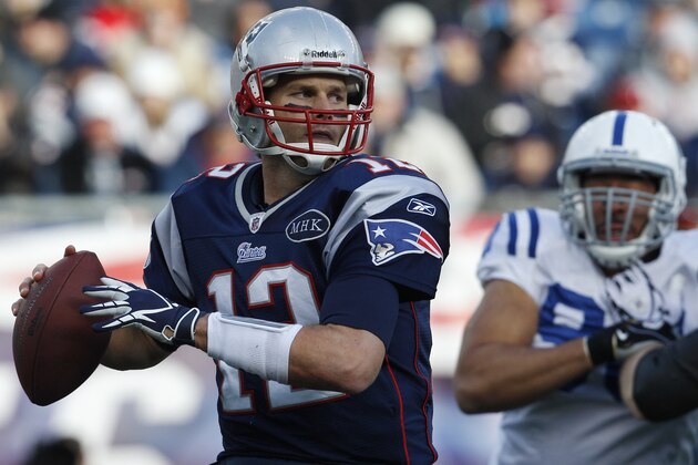 New England Patriots quarterback Tom Brady (12) looks to pass during the first half of an NFL football game against the Indianapolis Colts in Foxborough, Mass., Sunday Dec. 4, 2011. (AP Photo/Charles Krupa)