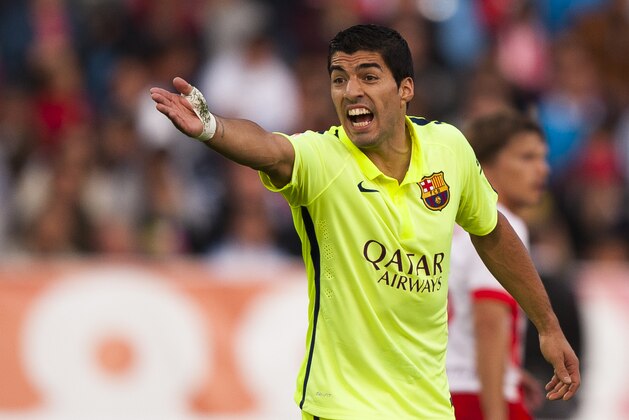 FC Barcelona's Luis Suarez gestures during a Spanish La Liga soccer match against UD Almeria in Almeria, Spain, Saturday, Nov. 8, 2014. (AP Photo/Daniel Tejedor)