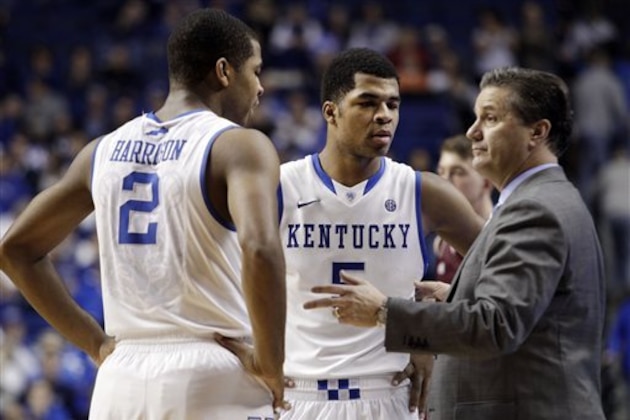 FILe - In this Jan. 21, 2014 file photo, Kentucky head coach John Calipari, right, instructs Aaron Harrison (2) and Andrew Harrison (5) during the second half of an NCAA college basketball game in Lexington, Ky. The Kentucky twin freshman guards will return for a second season to a stocked Wildcats squad coming off an NCAA championship appearance. (AP Photo/James Crisp, File)