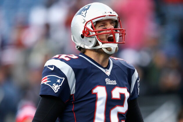FOXBORO, MA - NOVEMBER 02:  Tom Brady #12 of the New England Patriots yells as he warms up before a game against the Denver Broncos at Gillette Stadium on November 2, 2014 in Foxboro, Massachusetts.  (Photo by Jim Rogash/Getty Images)