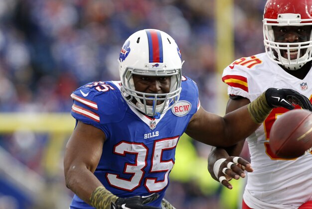Nov 9, 2014; Orchard Park, NY, USA; Buffalo Bills running back Bryce Brown (35) misses a pass as Kansas City Chiefs outside linebacker Justin Houston (50) defends during the first half at Ralph Wilson Stadium. Mandatory Credit: Kevin Hoffman-USA TODAY Sports