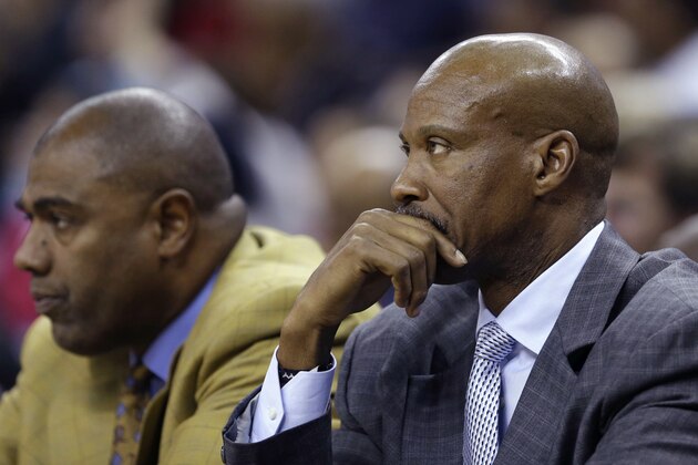 Los Angeles Lakers coach Byron Scott, right, and assistant coach Paul Pressey watch from the bench during the second half of an NBA basketball game against the New Orleans Pelicans in New Orleans, Wednesday, Nov. 12, 2014. The Pelicans won 109-102. (AP Photo/Gerald Herbert)