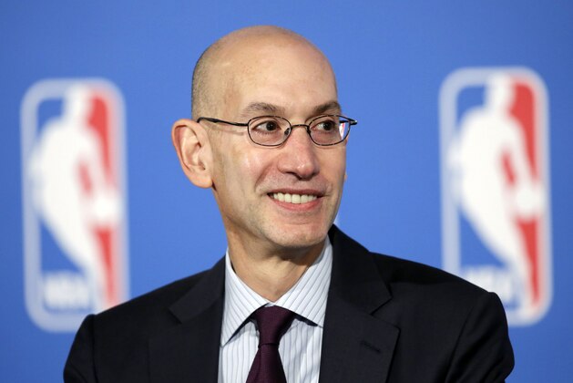 FILE - In this Oct. 6, 2014, file photo, NBA Commissioner Adam Silver answers questions at a news conference after a deal was announced between the league and TV networks in New York. New television contracts are going to inject a huge cash infusion into the league, and owners, executives, players and agents are all on pins and needles trying to anticipate what fiscal life will look like in the new NBA. (AP Photo/Mark Lennihan, File)
