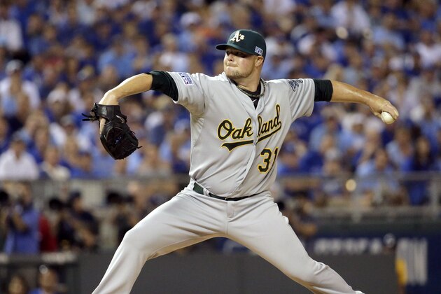 Oakland Athletics starting pitcher Jon Lester throws during the first inning of the AL wild-card playoff baseball game against the Kansas City Royals Tuesday, Sept. 30, 2014, in Kansas City, Mo. (AP Photo/Charlie Riedel)