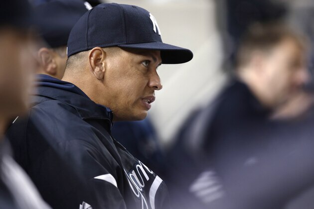New York Yankees' Alex Rodriguez grimaces as he watches a play during the Yankees' baseball game against the Tampa Bay Rays, Thursday, Sept. 26, 2013, in New York. (AP Photo/Kathy Willens)
