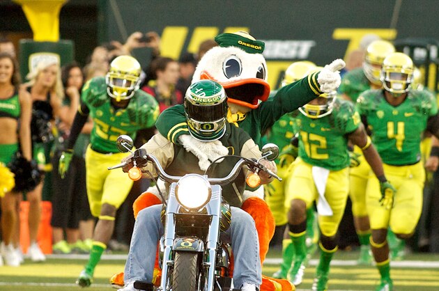 EUGENE, OR - SEPTEMBER 1:  The Oregon Duck mascot enters the stadium on a motorcycle before the game against the Arkansas State Red Wolves on September 1, 2012 at Autzen Stadium in Eugene, Oregon. Oregon won the game 57-34.  (Photo by Craig Mitchelldyer/Getty Images)