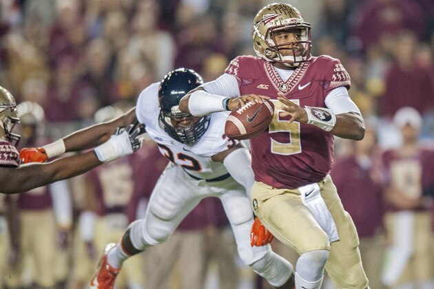 TALLAHASSEE, FL - NOVEMBER 8: Quarterback Jameis Winston #5 of the Florida State Seminoles avoinds a sack against the Virginia Cavaliers during the first half at Doak Campbell Stadium on November 8, 2014 in Tallahassee, Florida. (Photo by Jeff Gammons/Getty Images)