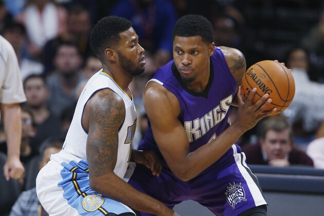 Sacramento Kings forward Rudy Gay, right, works ball inside as Denver Nuggets forward Alonzo Gee covers in the fourth quarter of the Kings' 110-105 victory in an NBA basketball game in Denver on Monday, Nov. 3, 2014. (AP Photo/David Zalubowski)