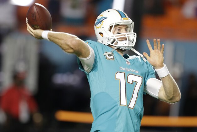 Miami Dolphins quarterback Ryan Tannehill throws a pass during warmups before the start of an NFL football game against the Buffalo Bills, Thursday, Nov. 13, 2014 in Miami Gardens, Fla. (AP Photo/Lynne Sladky)
