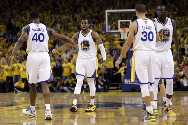 Golden State Warriors' Andre Iguodala (9) celebrates with teammates after scoring and getting fouled during the second half in Game 6 of an opening-round NBA basketball playoff series against the Los Angeles Clippers on Thursday, May 1, 2014, in Oakland, Calif. Golden State won 100-99. (AP Photo/Marcio Jose Sanchez)
