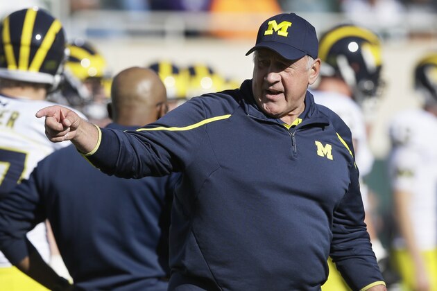 Michigan defensive coordinator Greg Mattison is seen before the first half of an NCAA college football game against Michigan State in East Lansing, Mich., Saturday, Oct. 25, 2014. (AP Photo/Carlos Osorio)