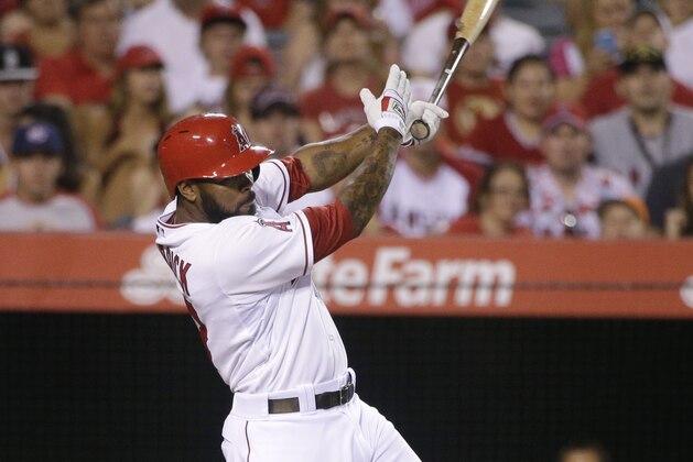 Los Angeles Angels' Howie Kendrick hits an RBI single during the seventh inning of a baseball game against the Houston Astros on Saturday, Sept. 13, 2014, in Anaheim, Calif. (AP Photo/Jae C. Hong)