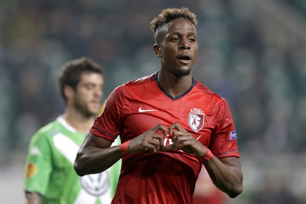 LOSC Lille's Divock Origi celebrates after scoring his side's first goal during the Europa League Group H soccer match between VfL Wolfsburg and LOSC Lille  at the Volkswagen Arena stadium in Wolfsburg, Germany, Thursday, Oct. 2, 2014. (AP Photo/Michael Sohn)