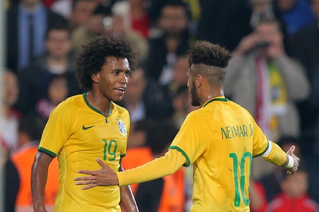 Brazil's Willian, left, and Neymar JR celebrate after a goal during their friendly soccer match with Turkey at Sukru Saracoglu Stadium in Istanbul, Turkey, Wednesday, Nov. 12, 2014. (AP Photo)