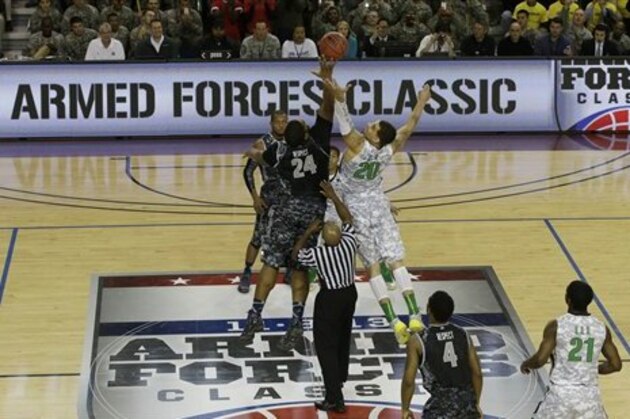 CORRECTS SPELLING OF CITY TO PYEONGTAEK - Oregon's Waverly Austin (20) battles for the jump ball with Georgetown's Joshua Smith (24) during the first half of an NCAA college basketball game in the Armed Forces Classic at Camp Humphreys in Pyeongtaek, south of Seoul, South Korea, Saturday, Nov. 9, 2013. (AP Photo/Lee Jim-man)