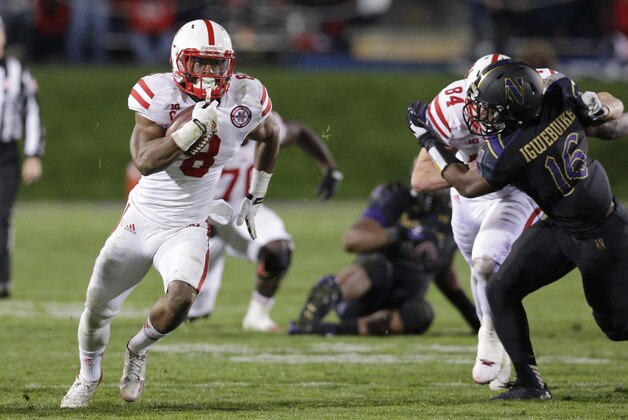 Nebraska running back Ameer Abdullah (8) runs with the ball against Northwestern during the second half of an NCAA college football game in Evanston, Ill., Saturday, Oct. 18, 2014. Nebraska won 38-17. (AP Photo/Nam Y. Huh)