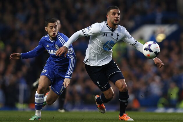 Chelsea's Eden Hazard, left, competes with Tottenham Hotspur's Kyle Walker during their English Premier League soccer match at Stamford Bridge, London, Saturday, March 8, 2014. (AP Photo/Sang Tan)