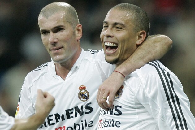 Real Madrids Brazilian striker Ronaldo, right, celebrates with Zinezine Zidane of France, center and Michel Salgado after Ronaldo scored against Real Sociadad during a Spanish league soccer match in Madrid Sunday, Dec. 12, 2004. (AP Photo/Paul White)