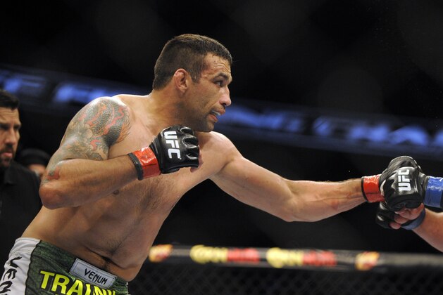 Apr 19, 2014; Orlando, FL, USA; Fabricio Werdum (red gloves) fights Travis Browne (blue gloves) before their heavyweight fight during UFC on FOX 11 at Amway Center. Mandatory Credit: David Manning-USA TODAY Sports