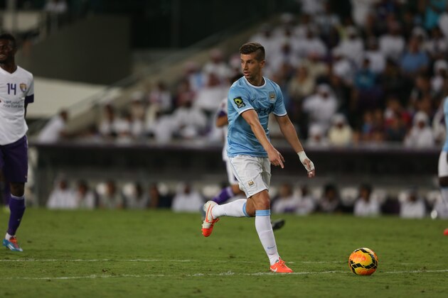 AL AIN, UNITED ARAB EMIRATES - MAY 15:  Matija Nastasic of Manchester City in action during the friendly match between Al Ain and Manchester City at Hazza bin Zayed Stadium on May 15, 2014 in Al Ain, United Arab Emirates.  (Photo by Warren Little/Getty Images)