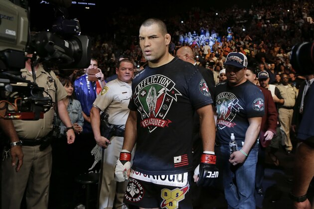 Cain Velasquez walks to the octagon for the UFC 160 mixed martial arts heavyweight title bout against Antonio Silva, Saturday, May 25, 2013, in Las Vegas. Velasquez won by technical knockout. (AP Photo/Julie Jacobson)
