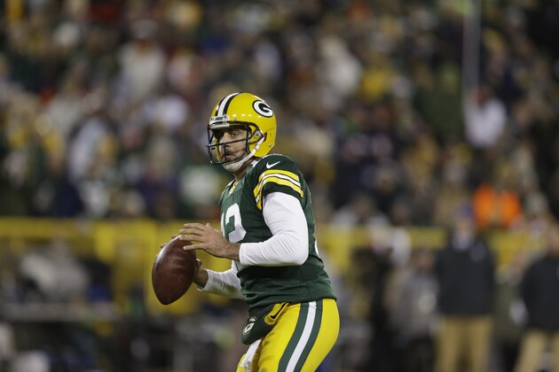 GREEN BAY, WI - NOVEMBER 9:  Aaron Rodgers #12 of the Green Bay Packers looks downfield during the game against the Chicago Bears at Lambeau Field on November 9, 2014 in Green Bay, Wisconsin.  The Packers defeated the Bears 55-14. (Photo Tom Lynn /Getty Images)