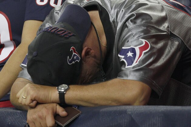 HOUSTON, TX- OCTOBER 09: A Houston Texans fan bends over dejected after the Indianapolis Colts defeated the Houston Texans in a NFL game on October 9, 2014 at NRG Stadium in Houston, Texas. Colts won 33 to 28. (Photo by Bob Levey/Getty Images)
