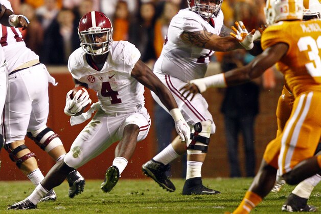 Alabama running back T.J. Yeldon (4) runs for yardage in the first quarter of an NCAA college football game against Tennessee, Saturday, Oct. 25, 2014 in Knoxville, Tenn. (AP Photo/Wade Payne)