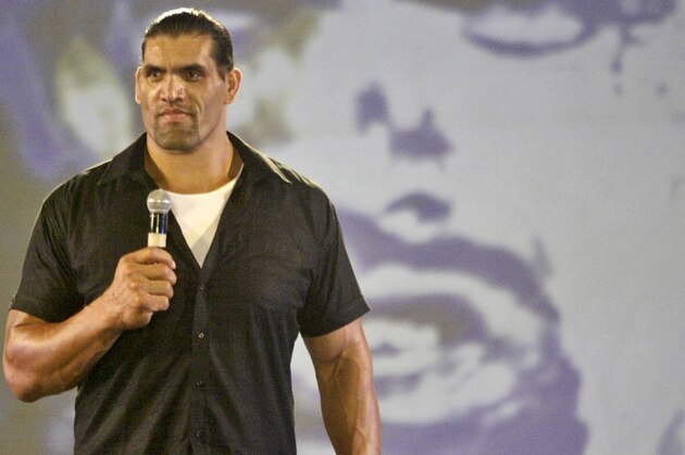 World Wrestling Entertainment (WWE) wrestler The Great Khali, standing 7 feet 3 inches (220 centimeters) and weighing 420 pounds (190 kilograms), speaks at a show organized to interact with fans in New Delhi, India, Wednesday, May 7, 2008. The entertainer, whose real name is Dilip Singh Rana, has earned prizes, movie roles and piles of money for his prowess on the wrestling mat along with earning a promotion in Punjab's police force. (AP Photo/Mustafa Quraishi)