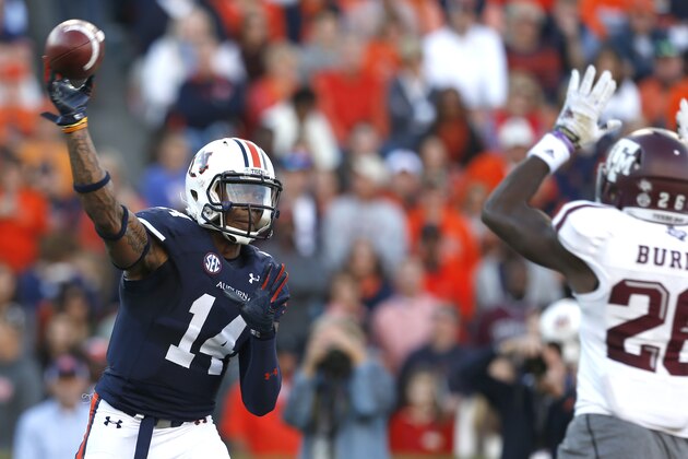 Auburn quarterback Nick Marshall (14) throws a pass against Texas A&M during the first half of an NCAA college football game on Saturday, Nov. 8, 2014, in Auburn, Ala. (AP Photo/Butch Dill)