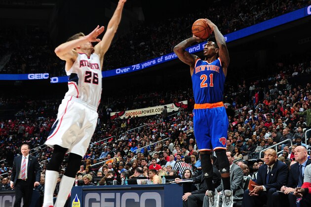 ATLANTA, GA - NOVEMBER 8: Iman Shumpert #21 of the New York Knicks puts up a shot against the Atlanta Hawks on November 8, 2014 at Philips Arena in Atlanta, Georgia.  NOTE TO USER: User expressly acknowledges and agrees that, by downloading and/or using this Photograph, user is consenting to the terms and conditions of the Getty Images License Agreement. Mandatory Copyright Notice: Copyright 2014 NBAE (Photo by Scott Cunningham/NBAE via Getty Images)