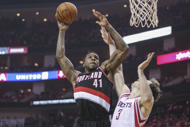 Apr 20, 2014; Houston, TX, USA; Portland Trail Blazers forward Thomas Robinson (41) shoots the ball as Houston Rockets center Omer Asik (3) defends in the first quarter of game one during the first round of the 2014 NBA Playoffs at Toyota Center. Mandatory Credit: Troy Taormina-USA TODAY Sports