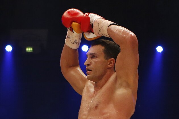 IBF, WBA, WBO and IBO champion Wladimir Klitschko from Ukraine celebrates knocking out his Australian challenger Alex Leapai during their heavyweight world title bout in Oberhausen, western Germany, Saturday, April 26, 2014. (AP Photo/Frank Augstein)