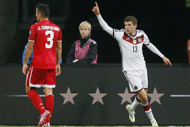 Germany's Thomas Mueller celebrates his side's second goal  during a Group D Euro 2016 qualifying match between Germany and Gibraltar in Nuremberg, Germany, Friday, Nov.14, 2014. (AP Photo/Michael Probst)