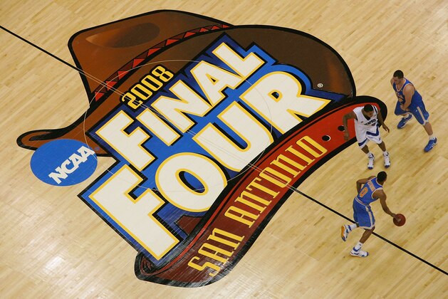 SAN ANTONIO - APRIL 05:  Russell Westbrook #0 of the UCLA Bruins moves the ball upcourt and uses a Kevin Love #42 screen on Derrick Rose #23 of the Memphis Tigers during the National Semifinal game of the NCAA Men's Final Four at the Alamodome on April 5, 2008 in San Antonio, Texas.  (Photo by Ronald Martinez/Getty Images)