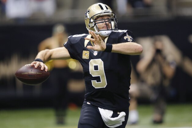New Orleans Saints quarterback Drew Brees (9) drops back to pass in the first half of an NFL football game against the San Francisco 49ers in New Orleans, Sunday, Nov. 9, 2014. (AP Photo/Bill Haber)