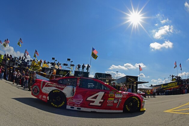 HOMESTEAD, FL - NOVEMBER 14:  Kevin Harvick, driver of the #4 Budweiser Chevrolet, drives through the garage area during practice for the NASCAR Sprint Cup Series Ford EcoBoost 400 at Homestead-Miami Speedway on November 14, 2014 in Homestead, Florida.  (Photo by Robert Laberge/Getty Images)